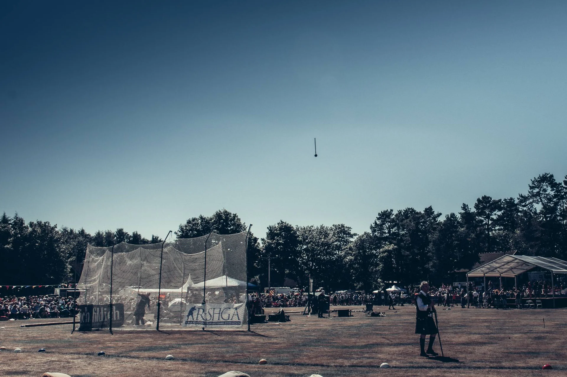 Overview of the Highland Games field in Scotland with hammer throw