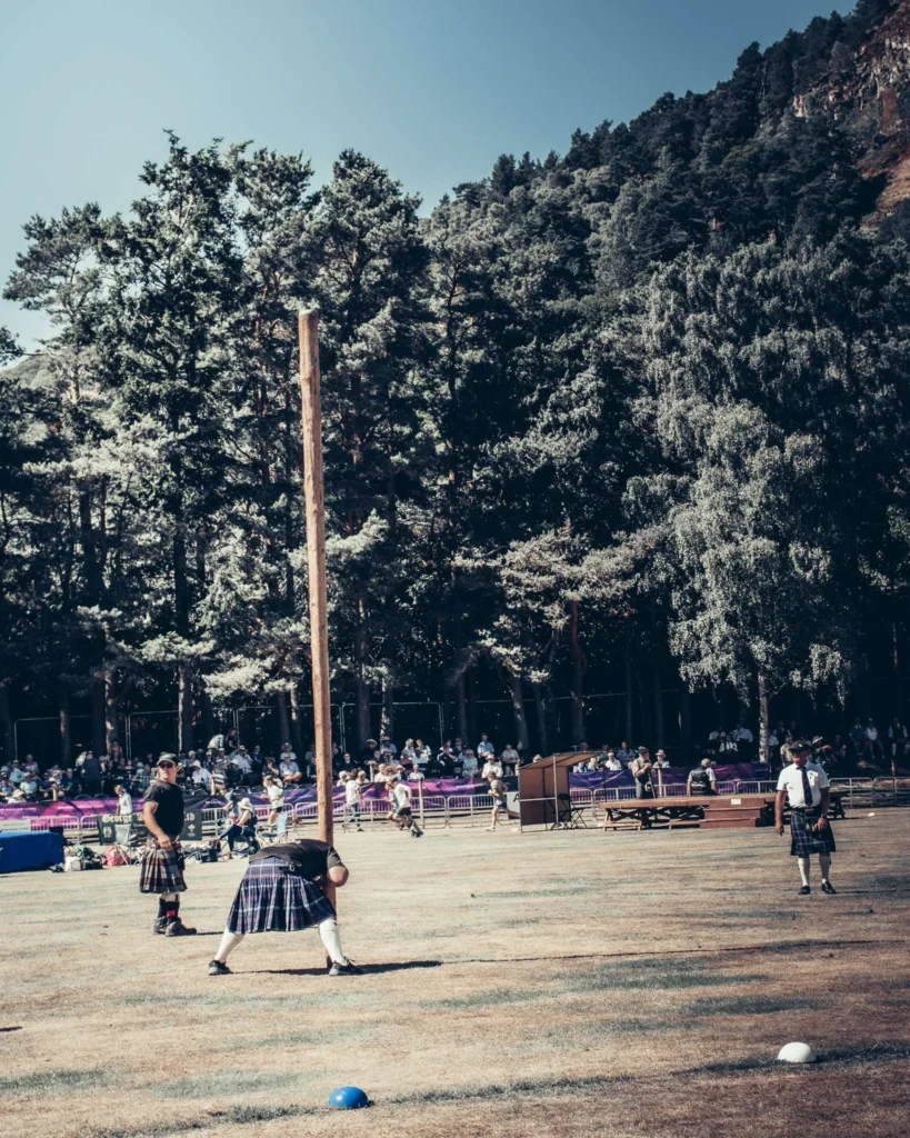 Log throwing competition at the Highland Games in Ballater