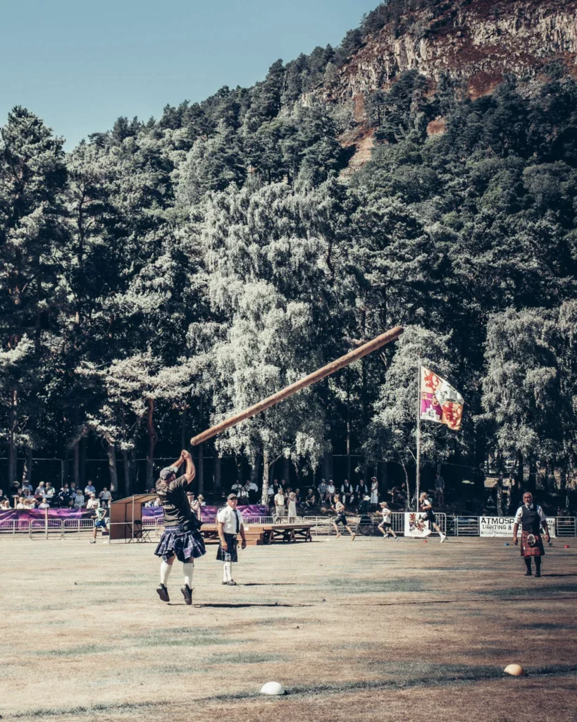 Man in kilt throws a log at the Highland Games