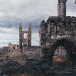 Ruins of St Andrews Cathedral with cemetery in the background in Scotland