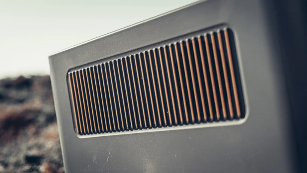 Close-up of the orange-trimmed air vent of the Aferiy Nomad 1800 power station