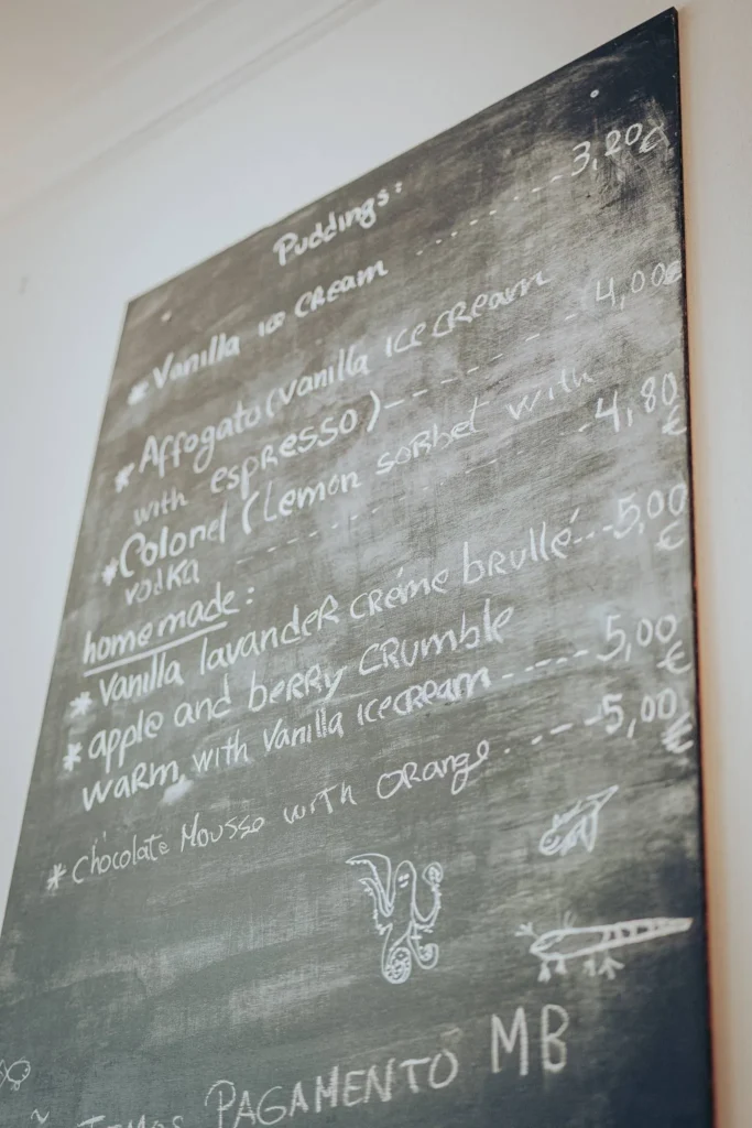 Slate board showing the dessert menu at Nikita restaurant in Tavira, Algarve
