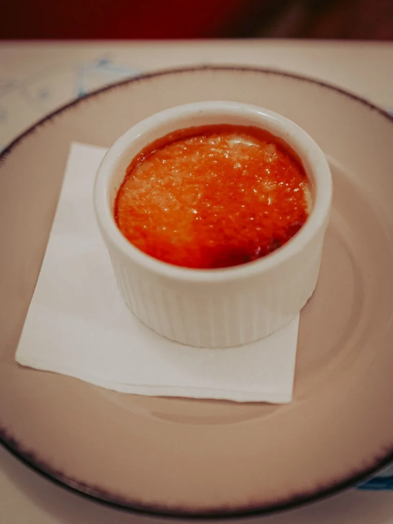 Lavender creme brulee served in a white ramekin at Nikita restaurant in Tavira, Algarve