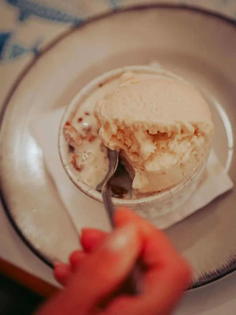 Apple crumble served with a scoop of vanilla ice cream at Nikita restaurant in Tavira, Algarve