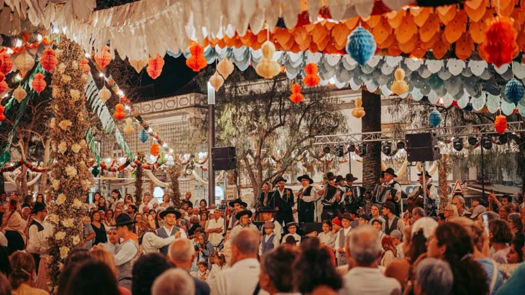 Night festival of São João in Tavira: paper decorations and folk group on stage
