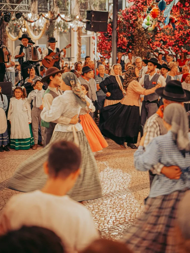 Traditional costume dancers from the Algarve during the São João corridinho in Tavira