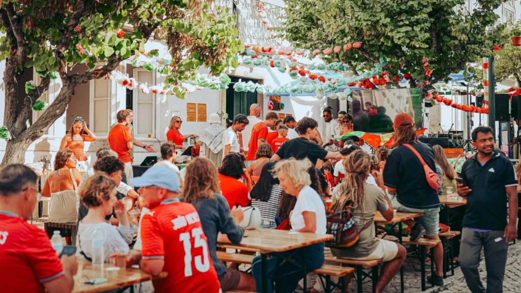 Tables, jerseys from Portugal and match screen during the São João in Tavira, Algarve