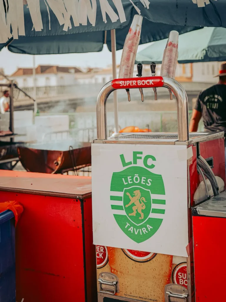 Super Bock tap at the LFC Leões de Tavira stand by the Rio Gilão during São João