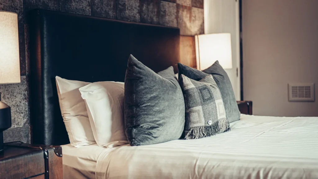 Detail of a made-up double bed in a room at the Allan Park Hotel in Stirling, Scotland.