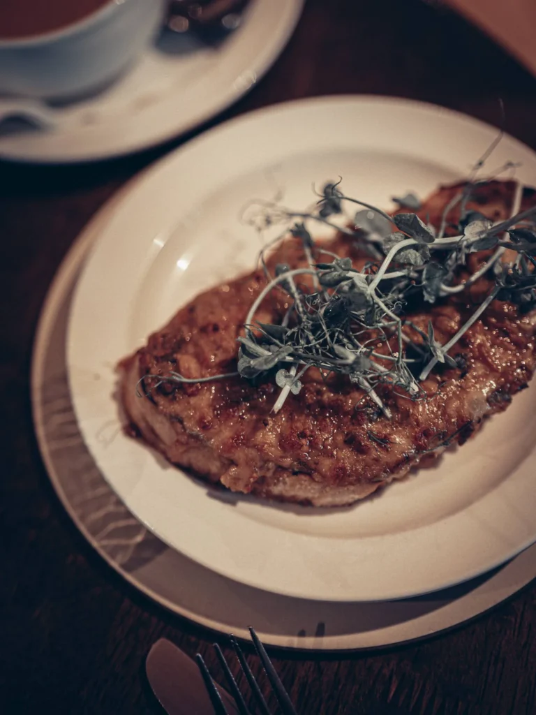Great Glen Rarebit at Roam West in Inchree, Onich: grilled sourdough under a Highland cheese and whisky sauce, topped with fresh shoots.