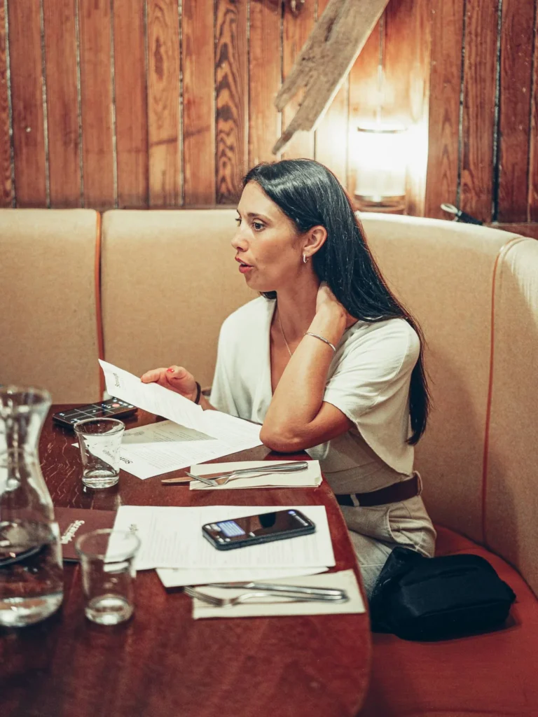 Caroline settled into a wooden alcove at Stravaigin, Glasgow, menu in hand. On this August 2026 visit Caroline and Xavier were seated upstairs, whereas they had eaten in the basement the first time.